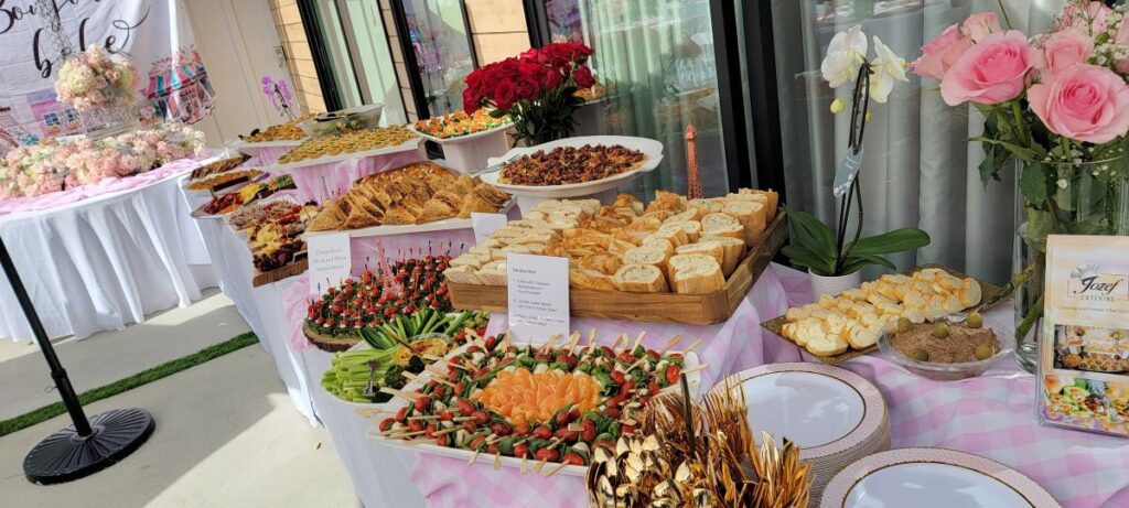 Luxury wedding catering services showcasing an elegant dessert table spread with Persian and international pastries.