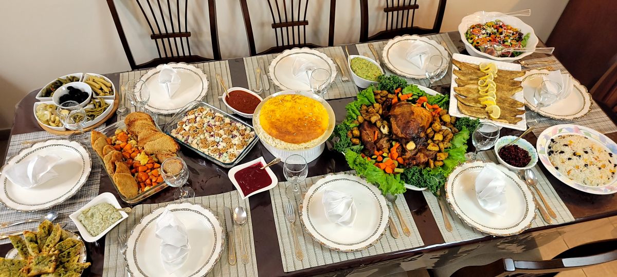 A vibrant buffet spread featuring premium Mediterranean appetizers and authentic Persian entrees tailored for a private event